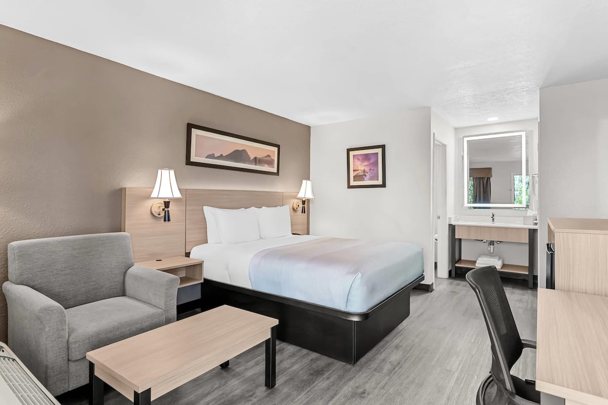 Premium bedding, desk, laptop workspace, blackout curtains