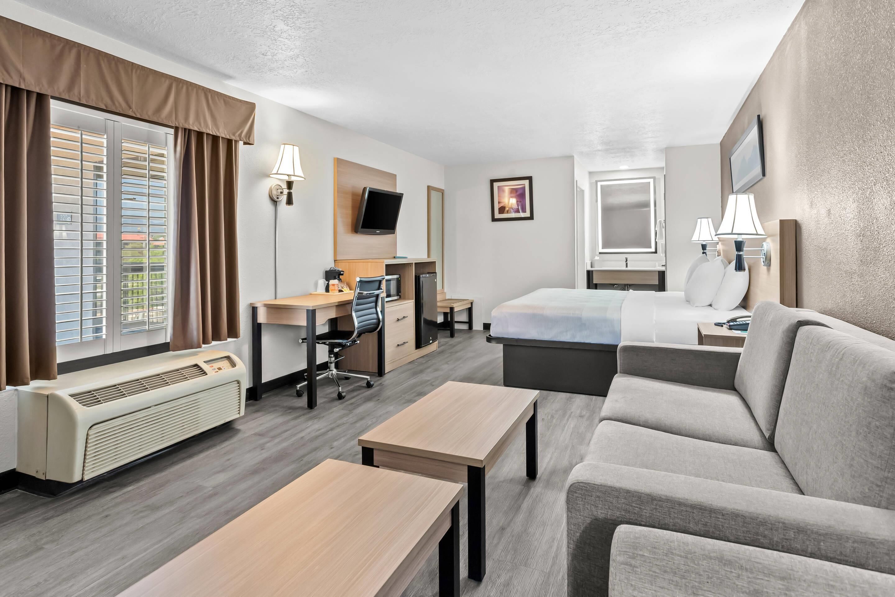 suite, 1 king bed, non smoking | premium bedding, desk, laptop workspace, blackout curtains