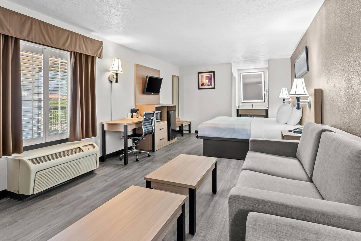 suite, 1 king bed, non smoking | premium bedding, desk, laptop workspace, blackout curtains