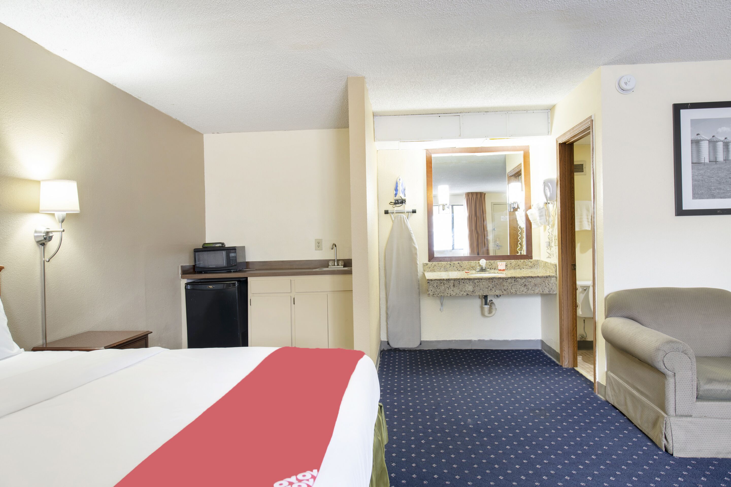 room, 1 king bed, jetted tub | desk, iron/ironing board, free wifi