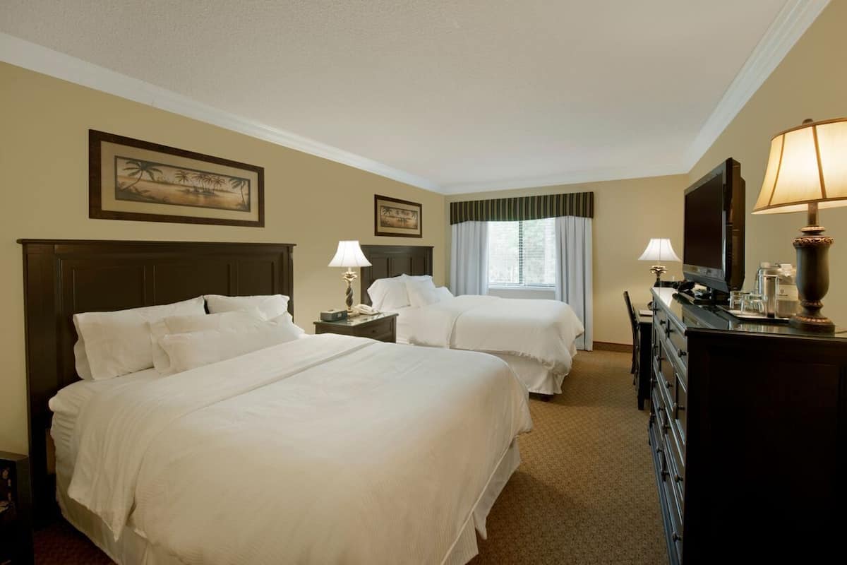 Deluxe Suite, 2 Bedrooms (1K-2Q) | Premium bedding, in-room safe, laptop workspace, blackout drapes