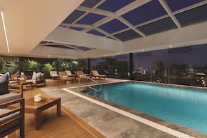 Indoor pool, open 8:00 AM to 10:00 PM, pool loungers