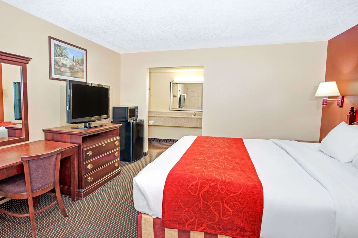 Premium bedding, blackout curtains, iron/ironing board