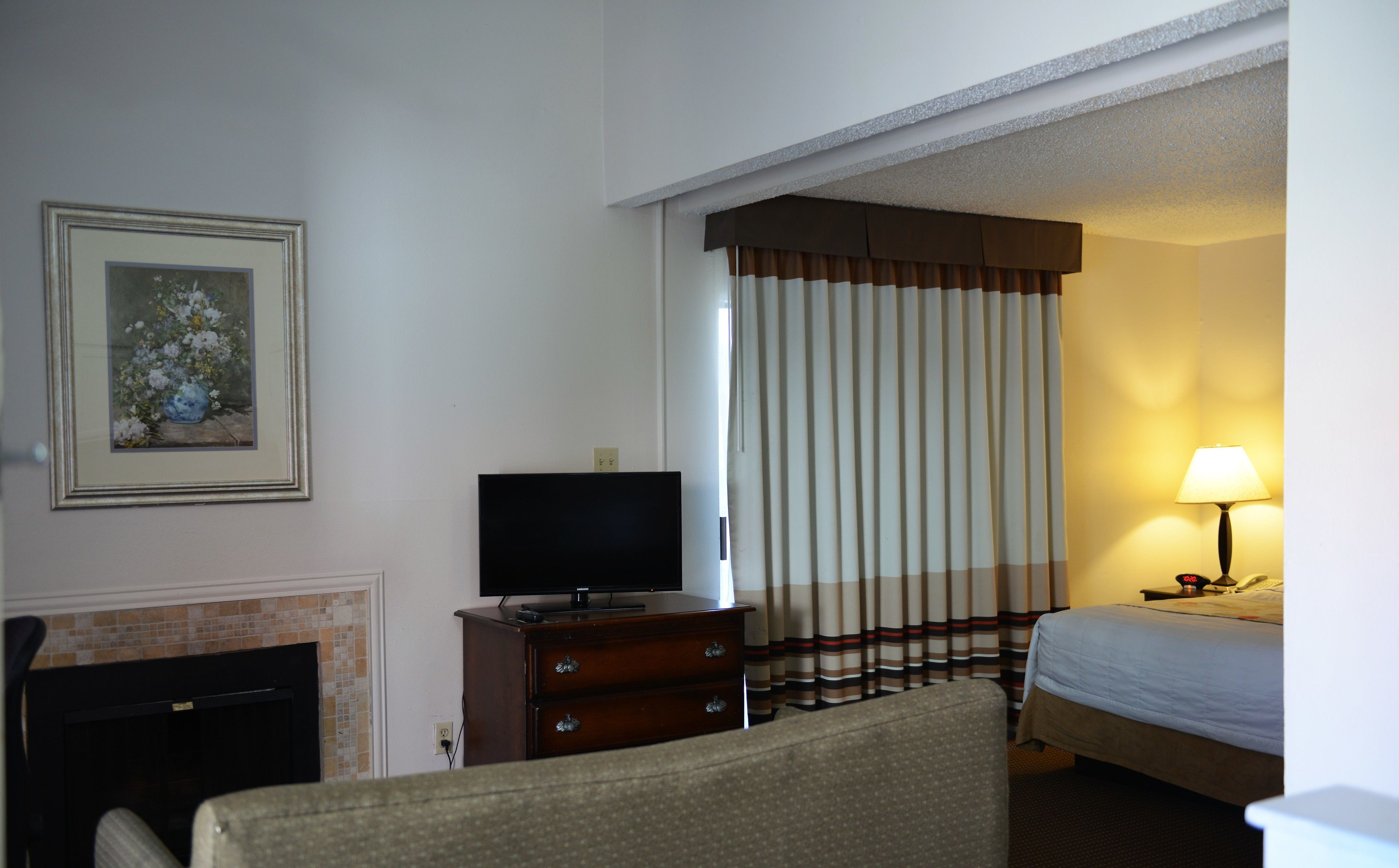 suite, 2 queen beds, non smoking (one-bedroom) | living area | 27-inch flat-screen tv with cable channels, tv, fireplace