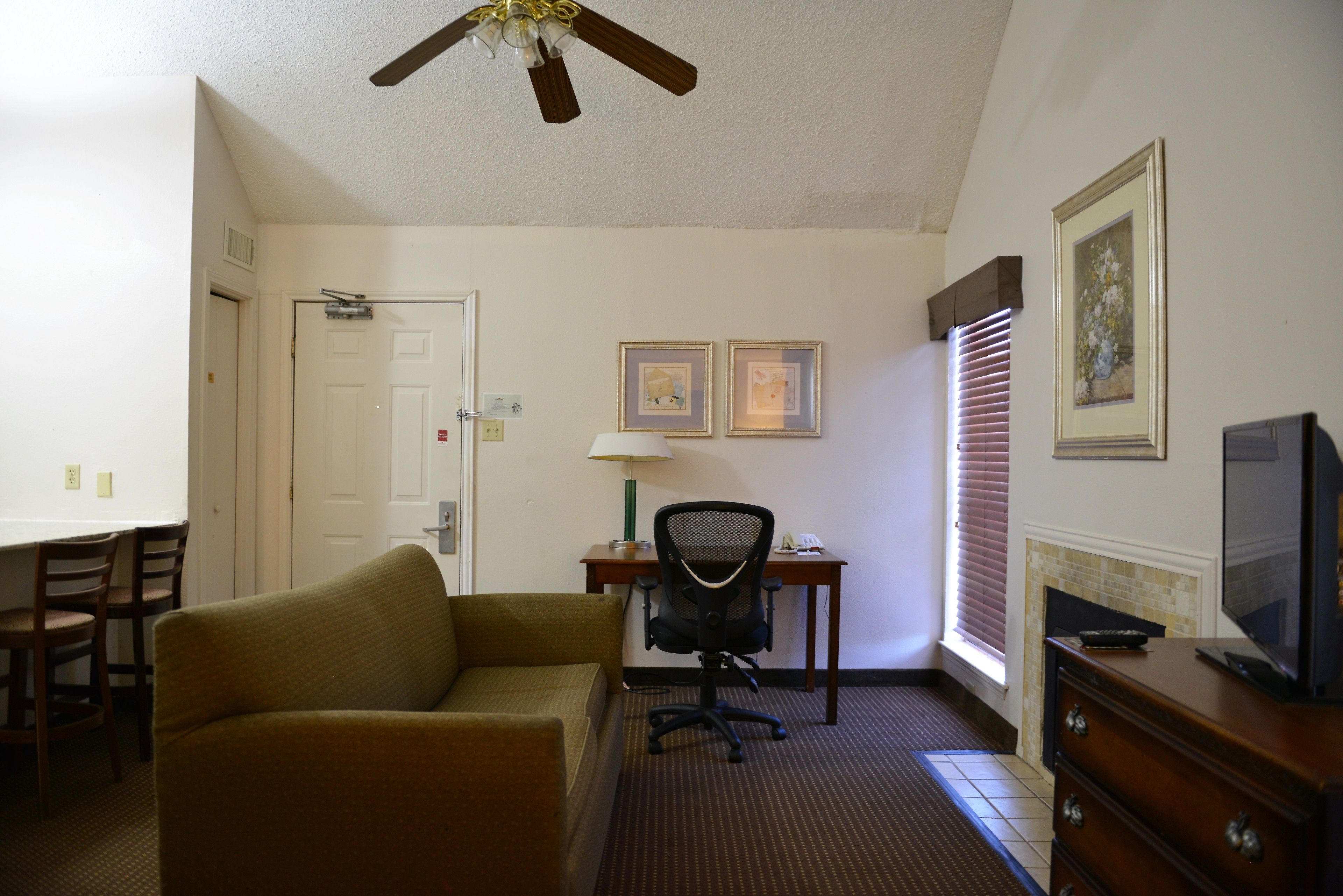 suite, 2 queen beds, non smoking (one-bedroom) | living area | 27-inch flat-screen tv with cable channels, tv, fireplace