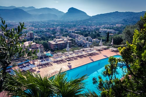 Outdoor pool, open 9 AM to 7 PM, pool umbrellas, pool loungers