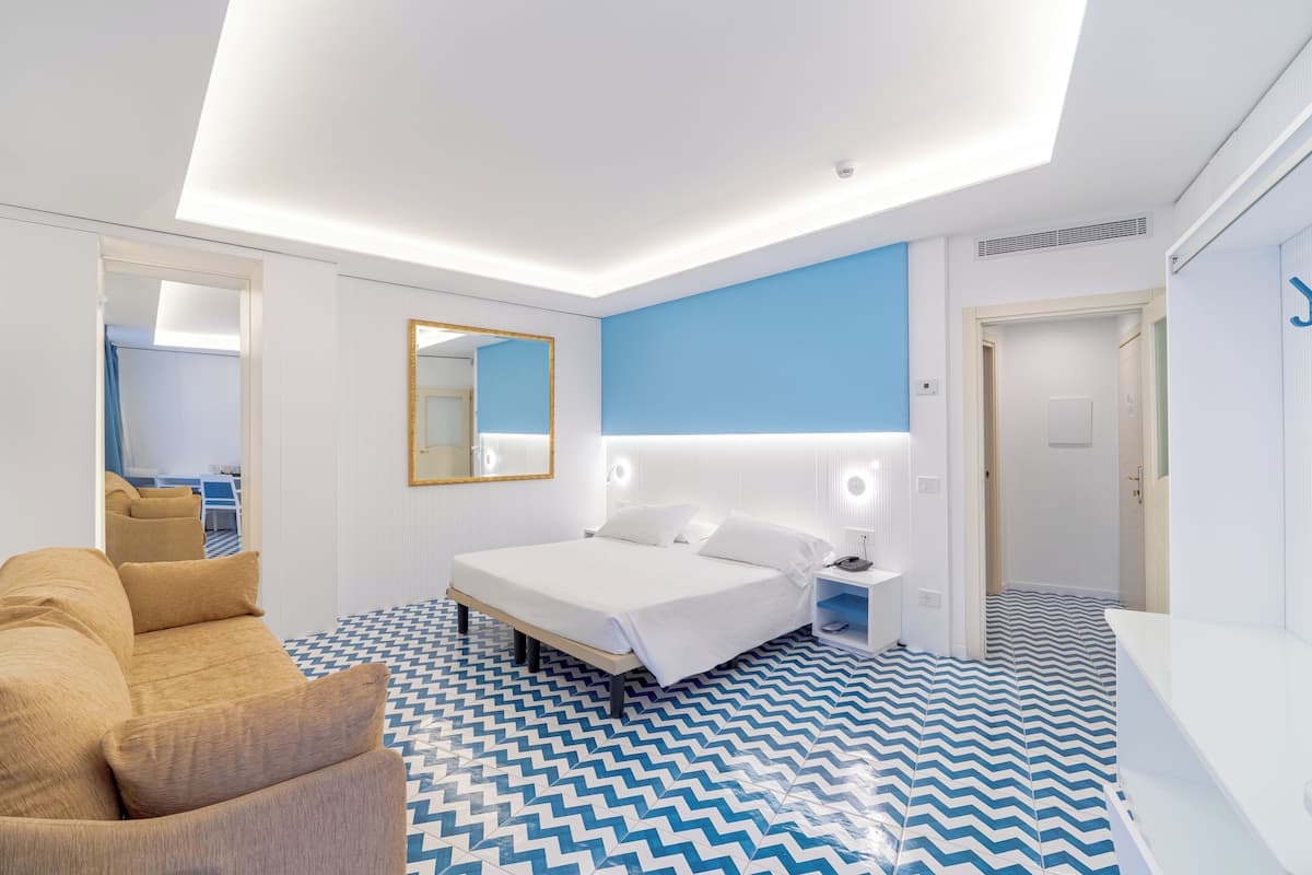 Standard Quadruple Room, 1 Bedroom | Premium bedding, minibar, in-room safe, desk