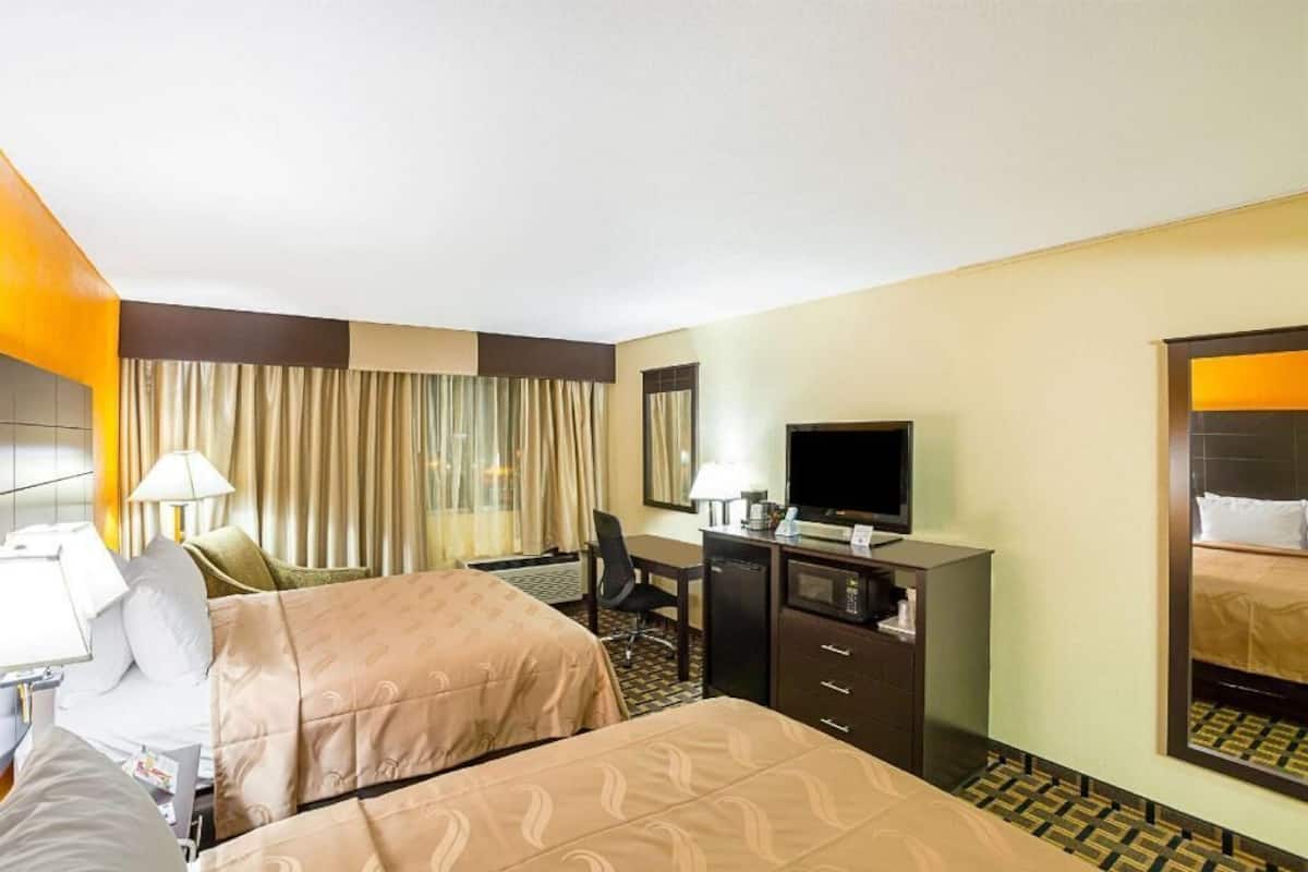 Pillowtop beds, desk, blackout drapes, iron/ironing board