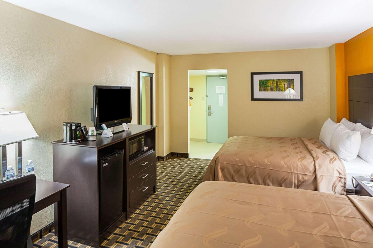 Pillowtop beds, desk, blackout drapes, iron/ironing board