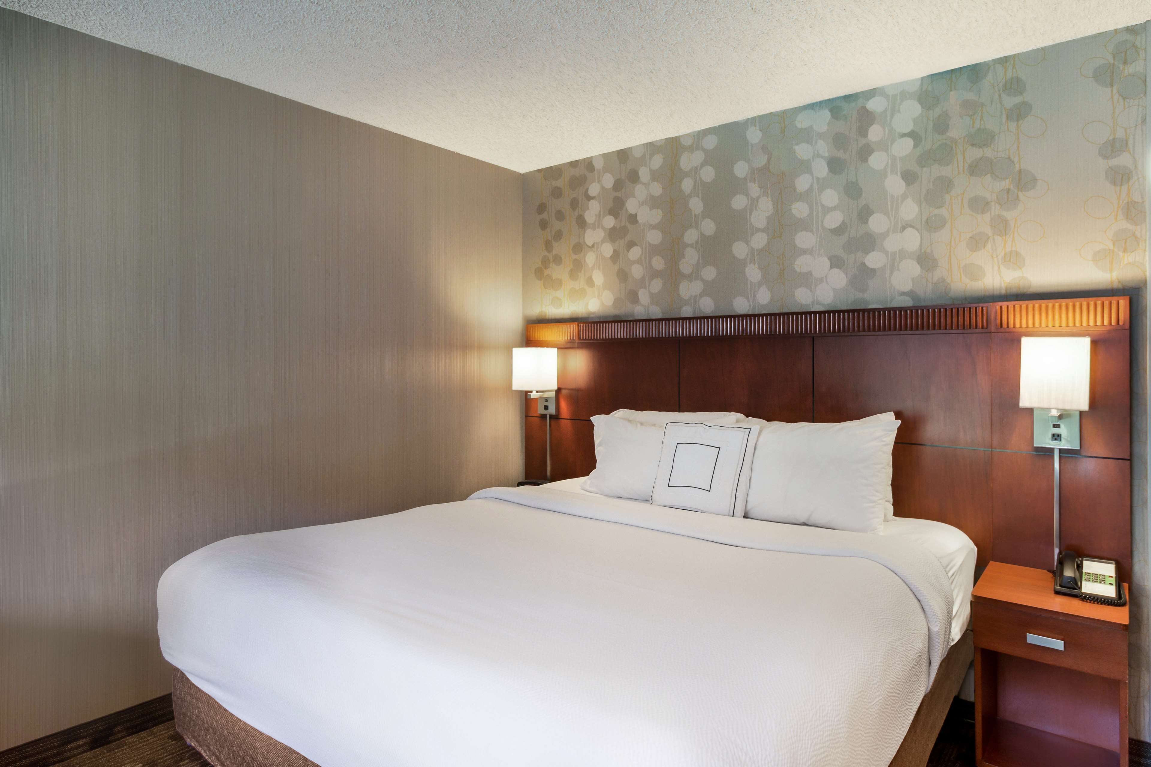 premium bedding, pillow-top beds, desk, laptop workspace