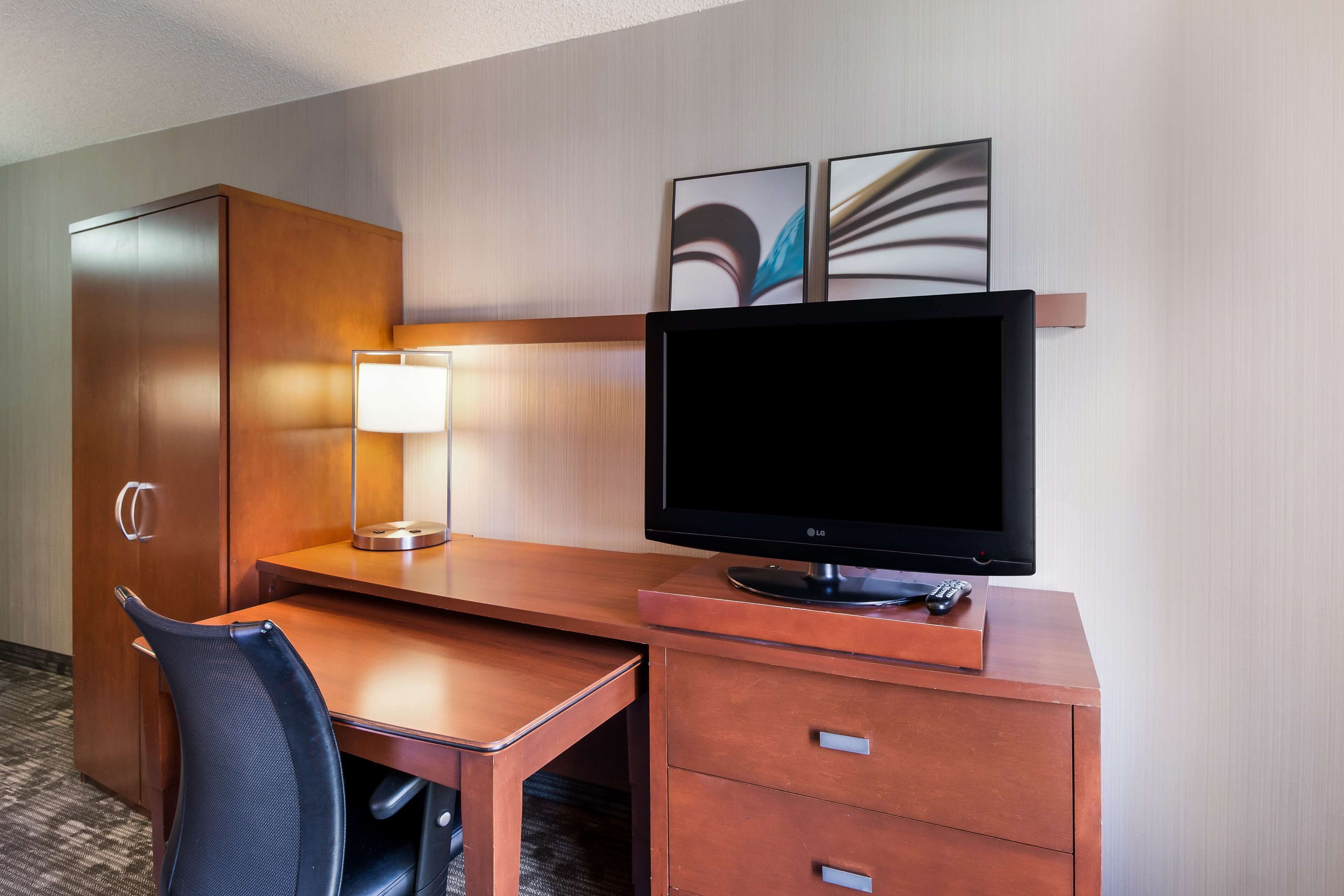 premium bedding, pillow-top beds, desk, laptop workspace
