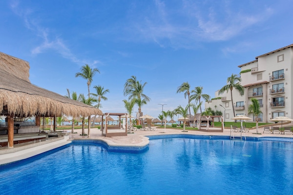 Outdoor pool, open 8:00 AM to 8:00 PM, pool cabanas (surcharge)