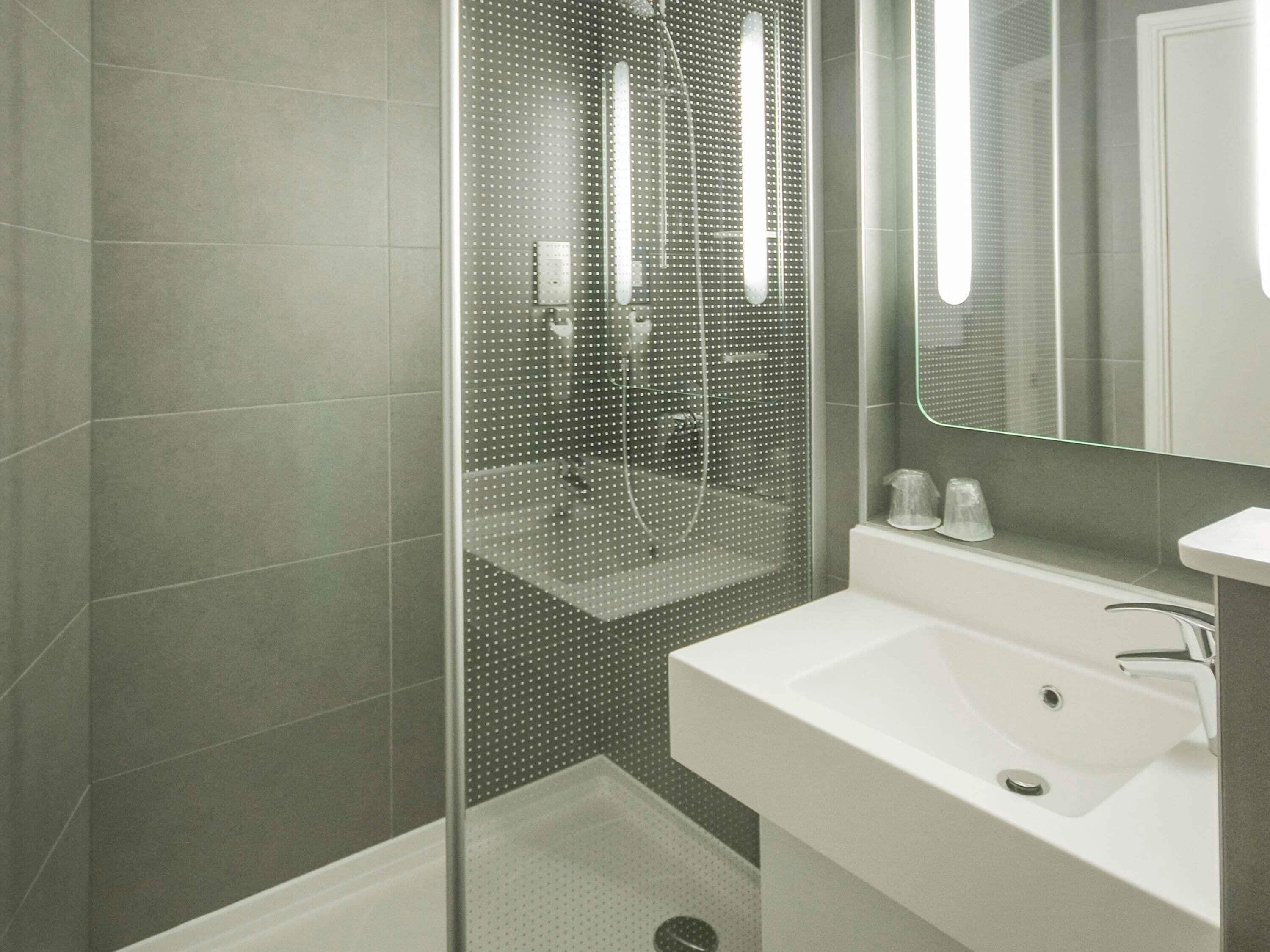 Shower, eco-friendly toiletries, hair dryer, towels