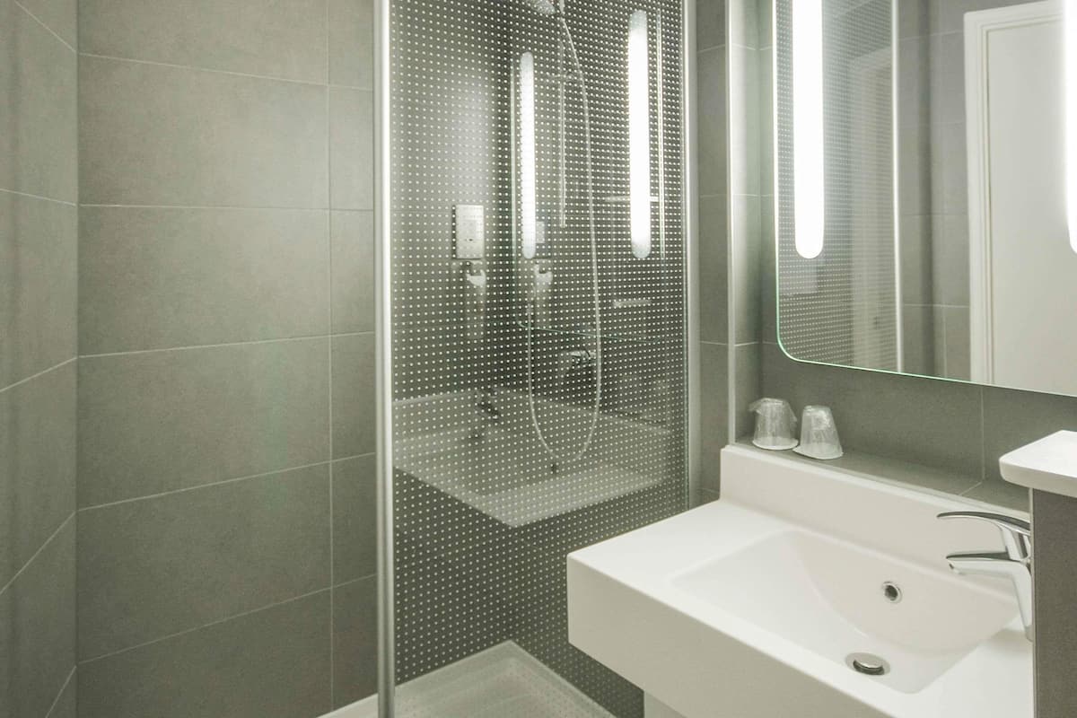 Shower, eco-friendly toiletries, hair dryer, towels