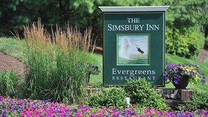 A sign for The Simsbury Inn, featuring a swan on water. - Simsbury Inn (Weatogue)