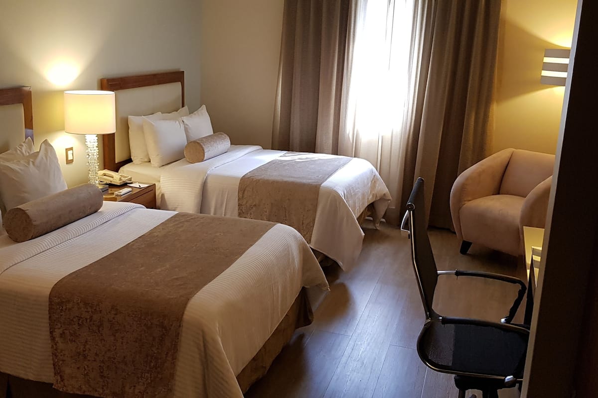 Standard Room, 2 Double Beds | In-room safe, desk, soundproofing, iron/ironing board