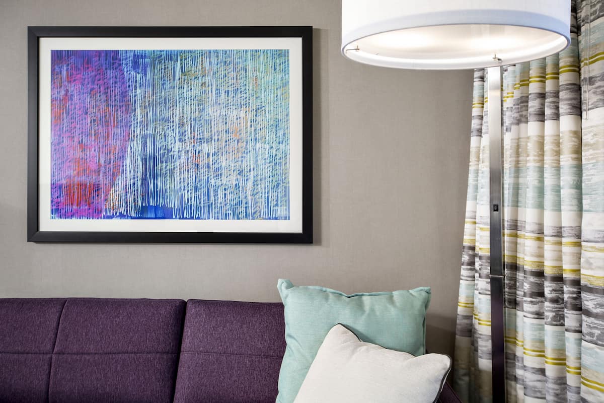 Premium bedding, desk, laptop workspace, blackout curtains