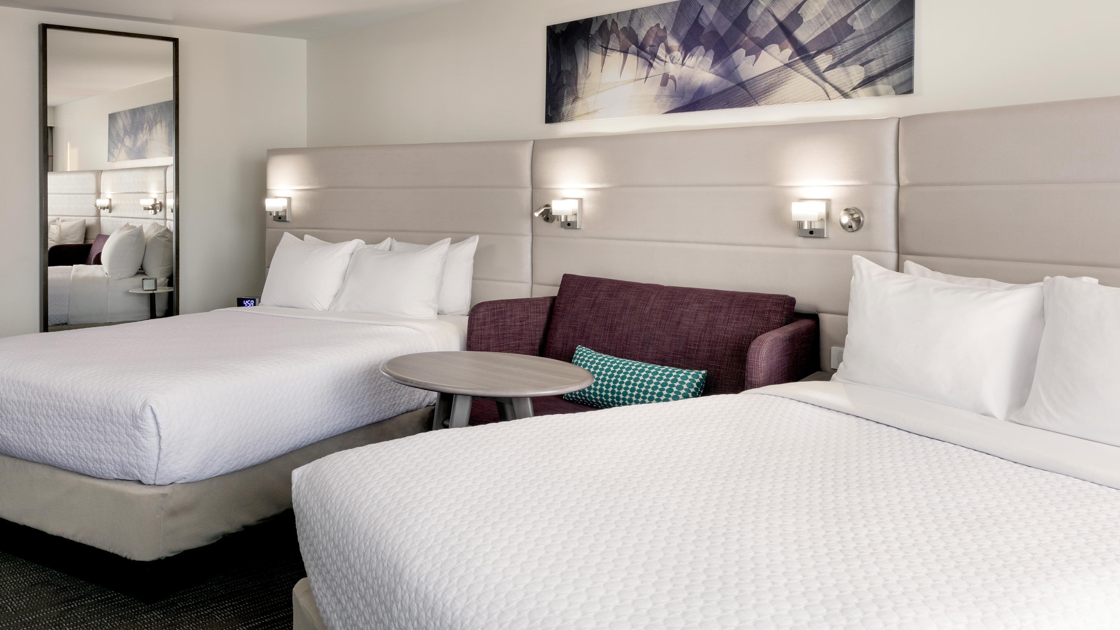 Premium bedding, desk, laptop workspace, blackout curtains