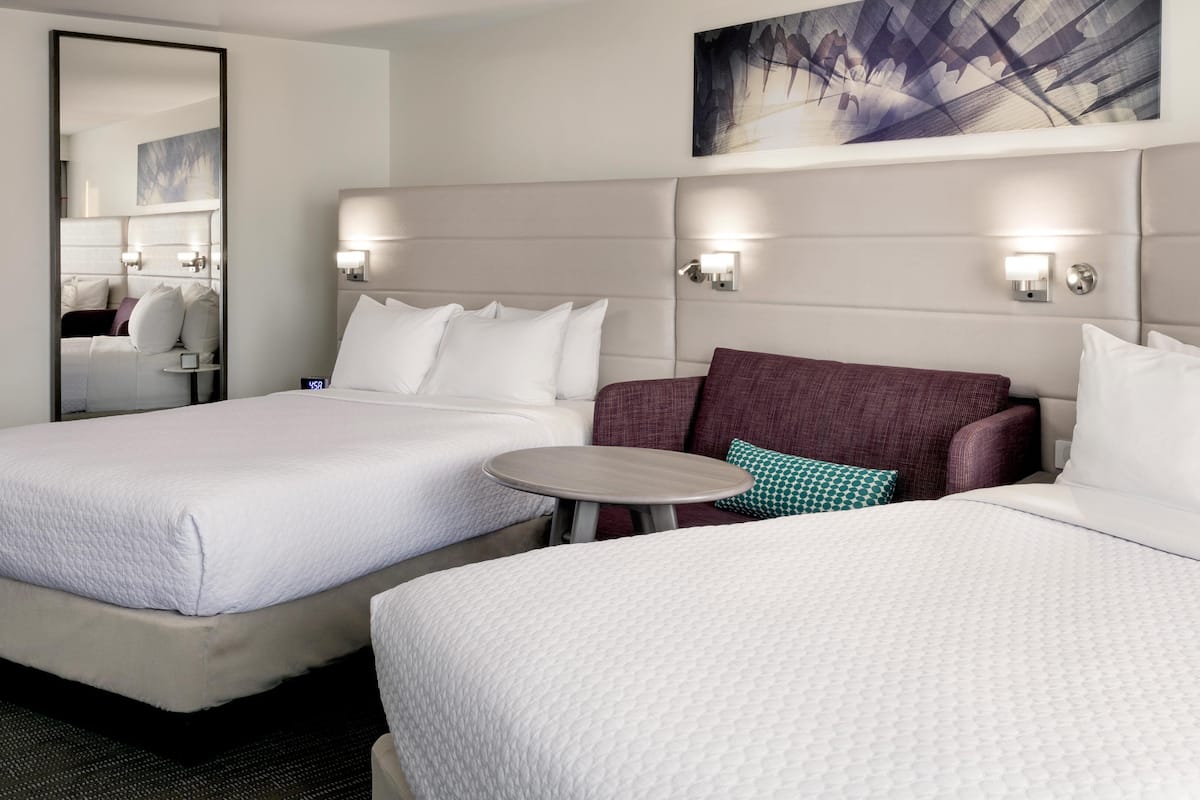 Premium bedding, desk, laptop workspace, blackout curtains