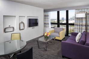 Premium bedding, desk, laptop workspace, blackout drapes