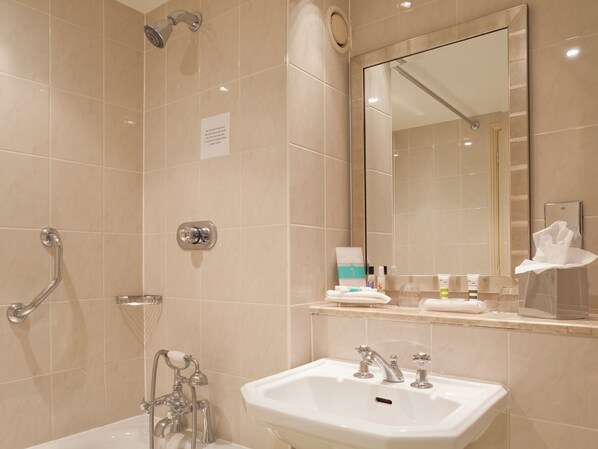 A modern bathroom with a bathtub, a shower, and a sink. - Sunday London Staines-upon-Thames Heathrow T5 (Staines)