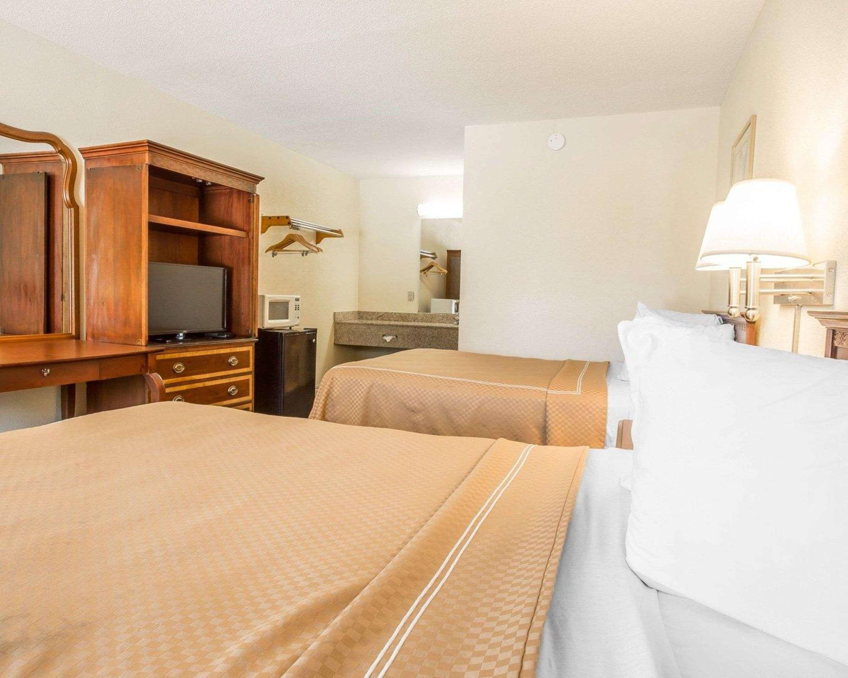 Desk, blackout curtains, iron/ironing board, rollaway beds
