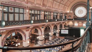 A grand hall with a high arched ceiling, multiple balconies, and a central stage area. - Crowne Plaza Indianapolis-Dwtn-Union Stn by IHG (Indianapolis)