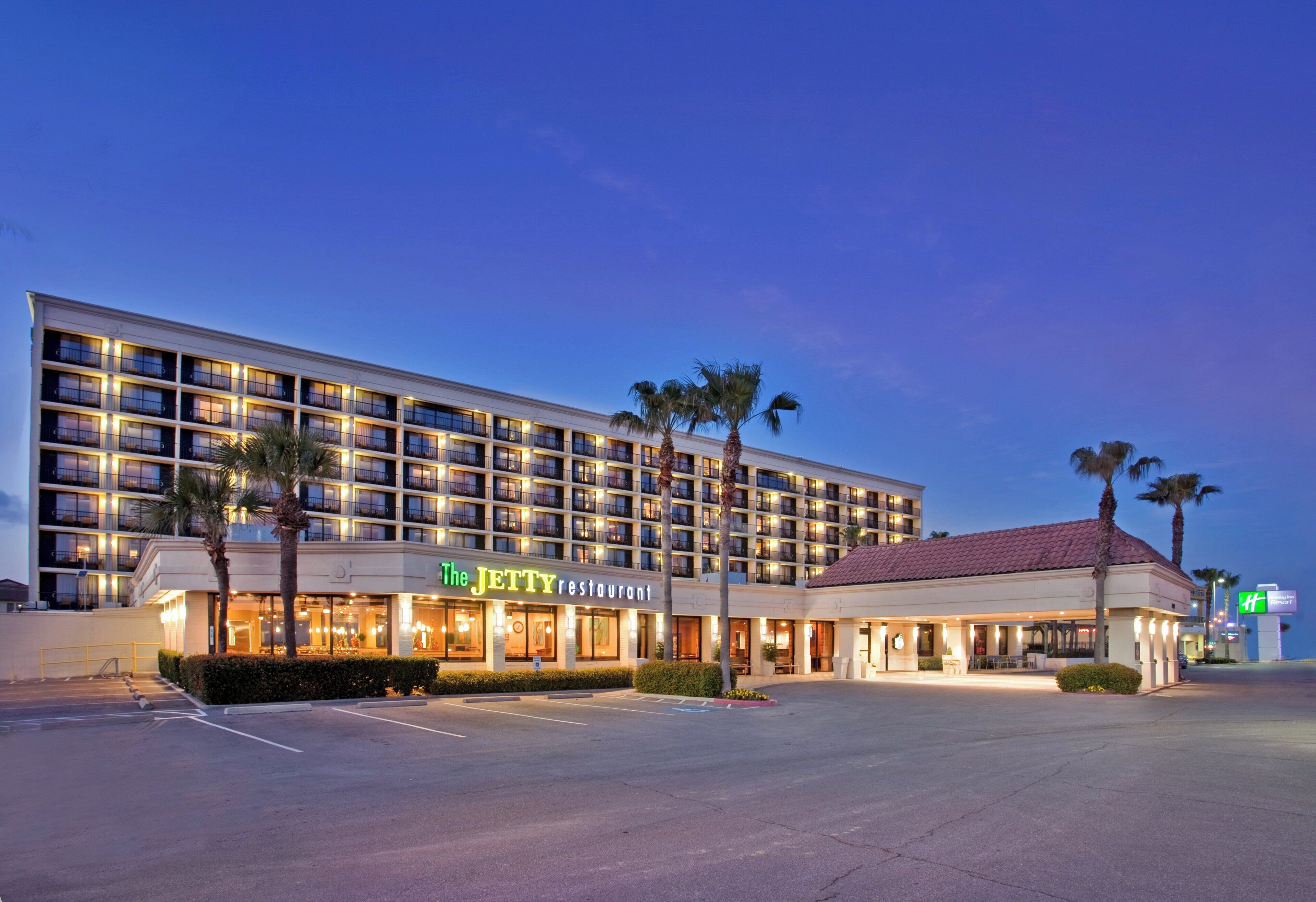 A hotel with multiple floors, a restaurant named 'The Jetty,' and a parking lot.