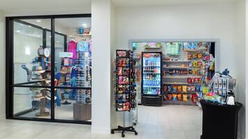 A retail store with a variety of products including hats, toys, and snacks.