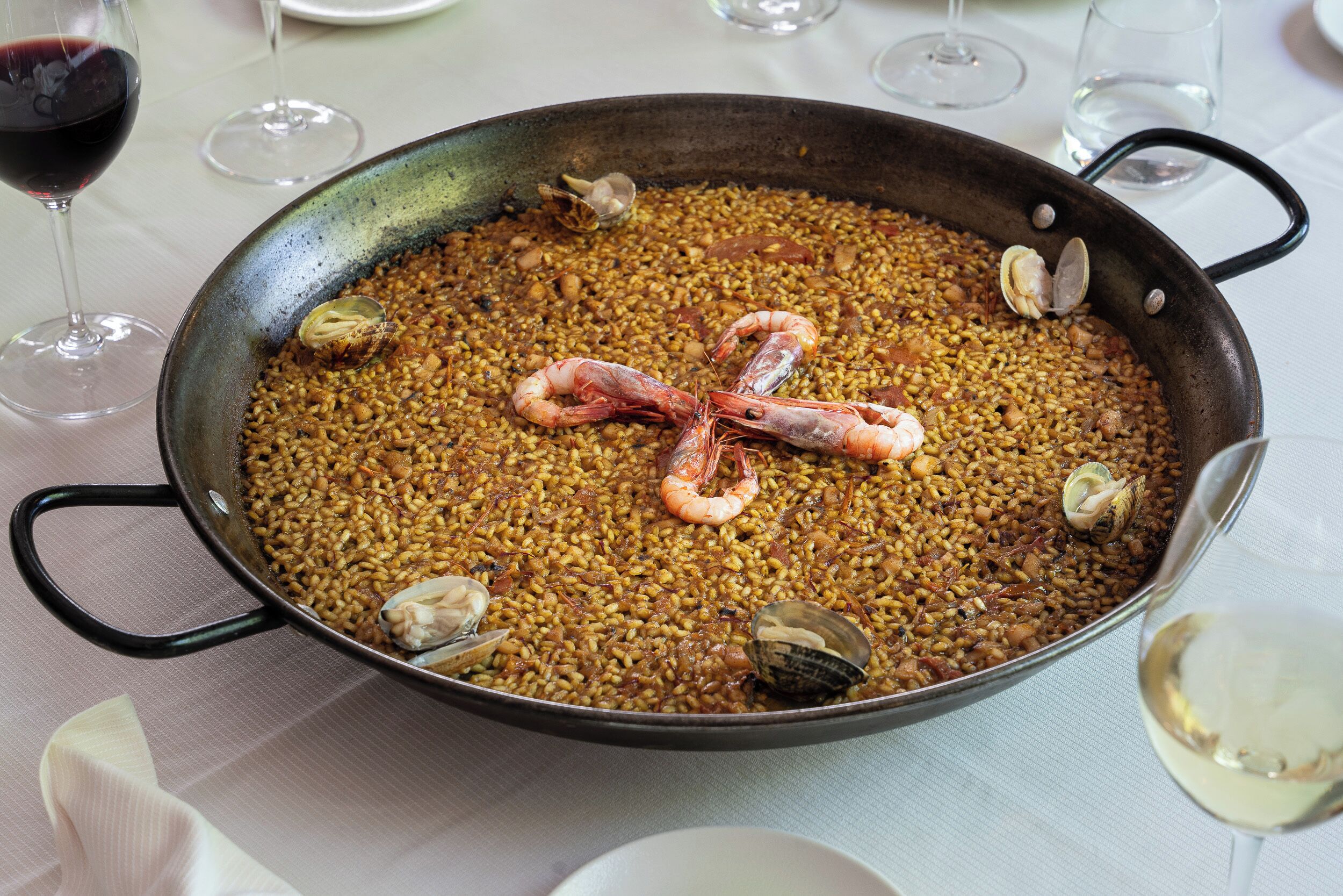 A large pan filled with seafood paella.