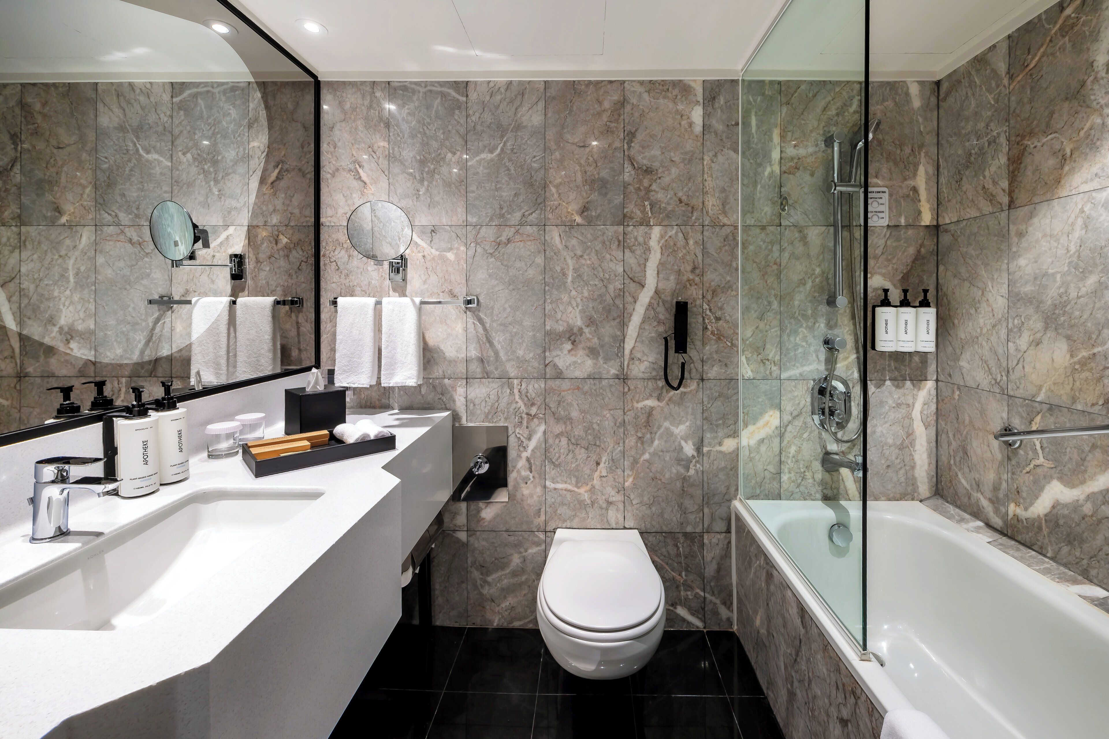 deep-soaking bathtub, rainfall showerhead, designer toiletries