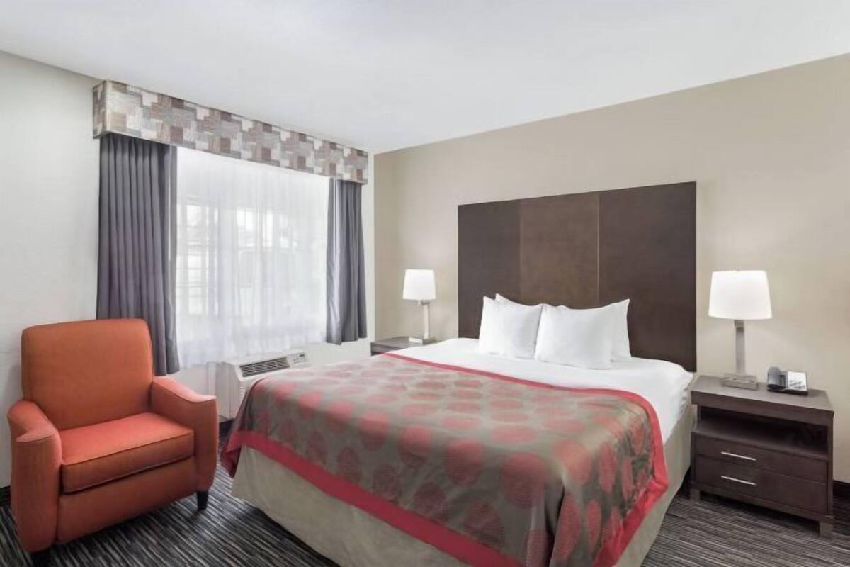 Premium bedding, desk, laptop workspace, blackout curtains
