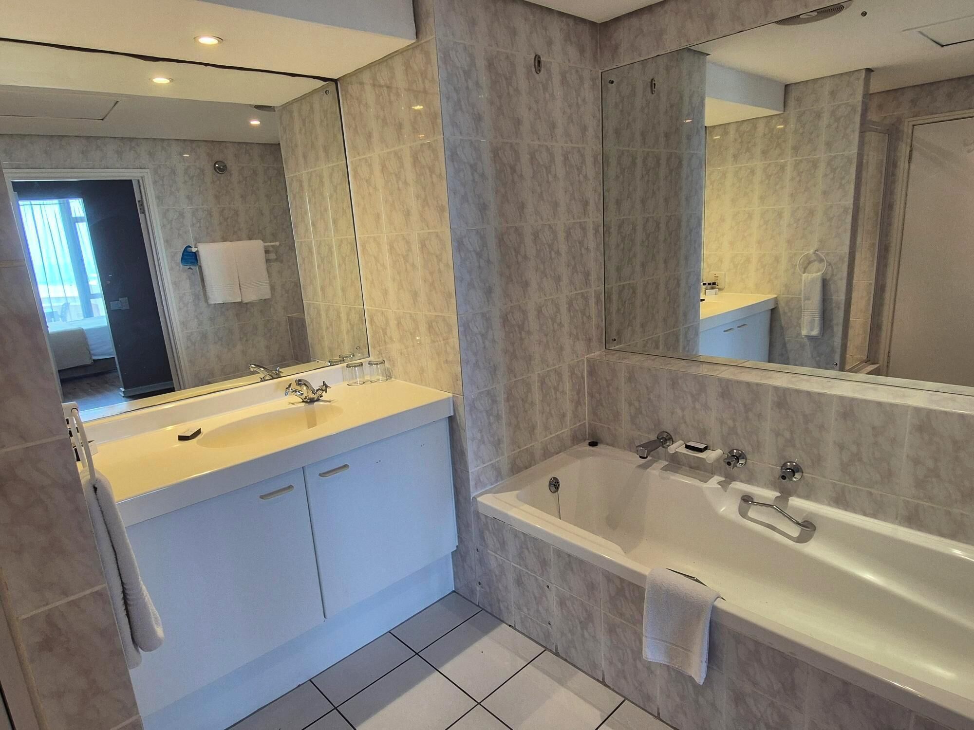 standard studio, 1 queen bed | bathroom | separate bathtub and shower, free toiletries, hair dryer, towels