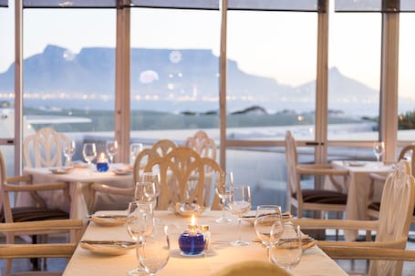 Breakfast, lunch, dinner served; beach views