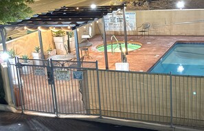 Outdoor pool, open 7:00 AM to 10:00 PM, pool loungers