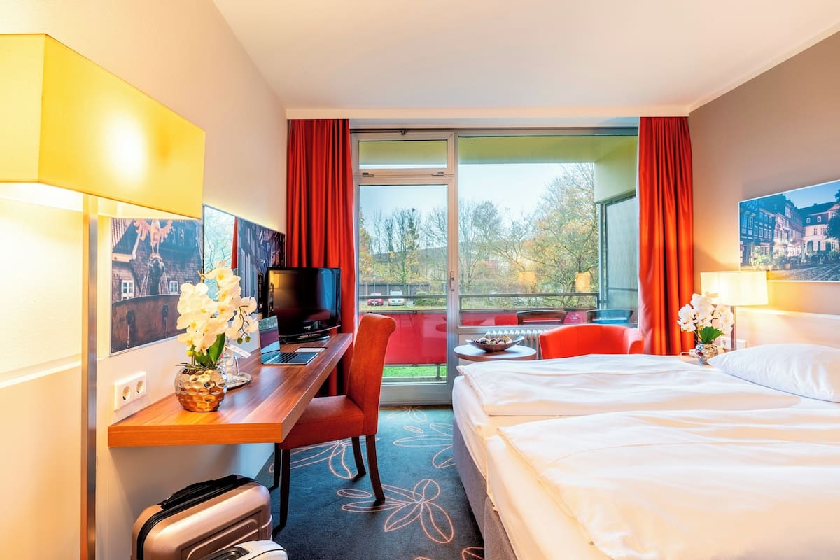 Hypo-allergenic bedding, desk, iron/ironing board, rollaway beds