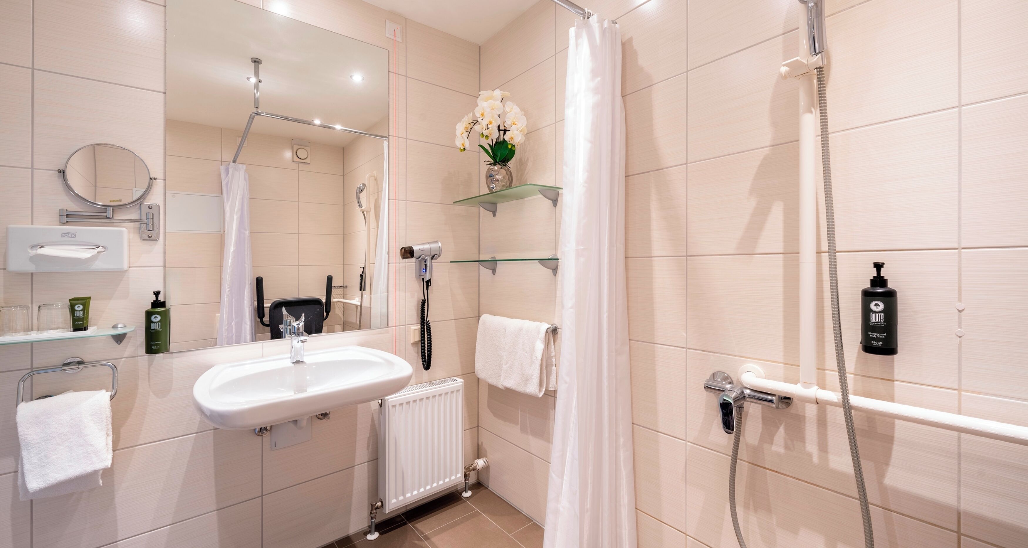 hair dryer, towels, soap, toilet paper