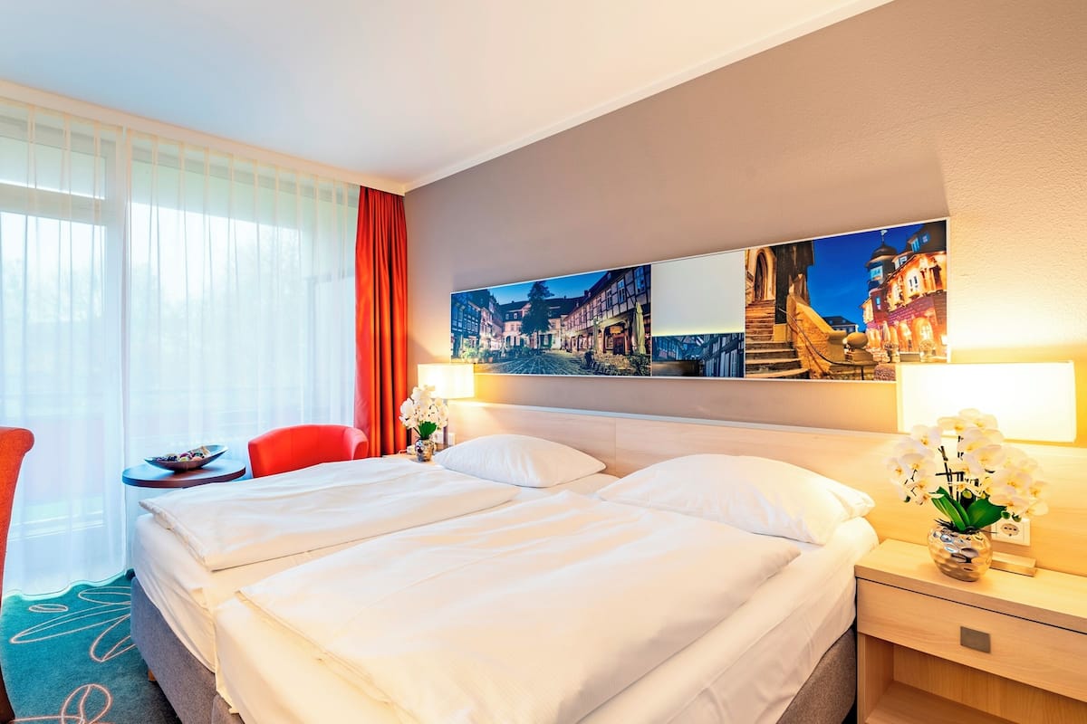 Hypo-allergenic bedding, desk, iron/ironing board, rollaway beds