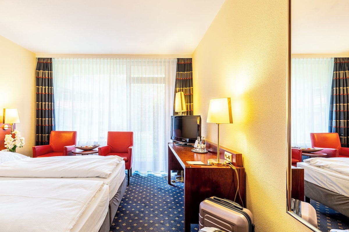 Hypo-allergenic bedding, desk, iron/ironing board, rollaway beds