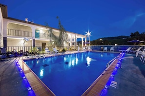 Outdoor pool, open 9:00 AM to 9:00 PM, pool umbrellas, sun loungers