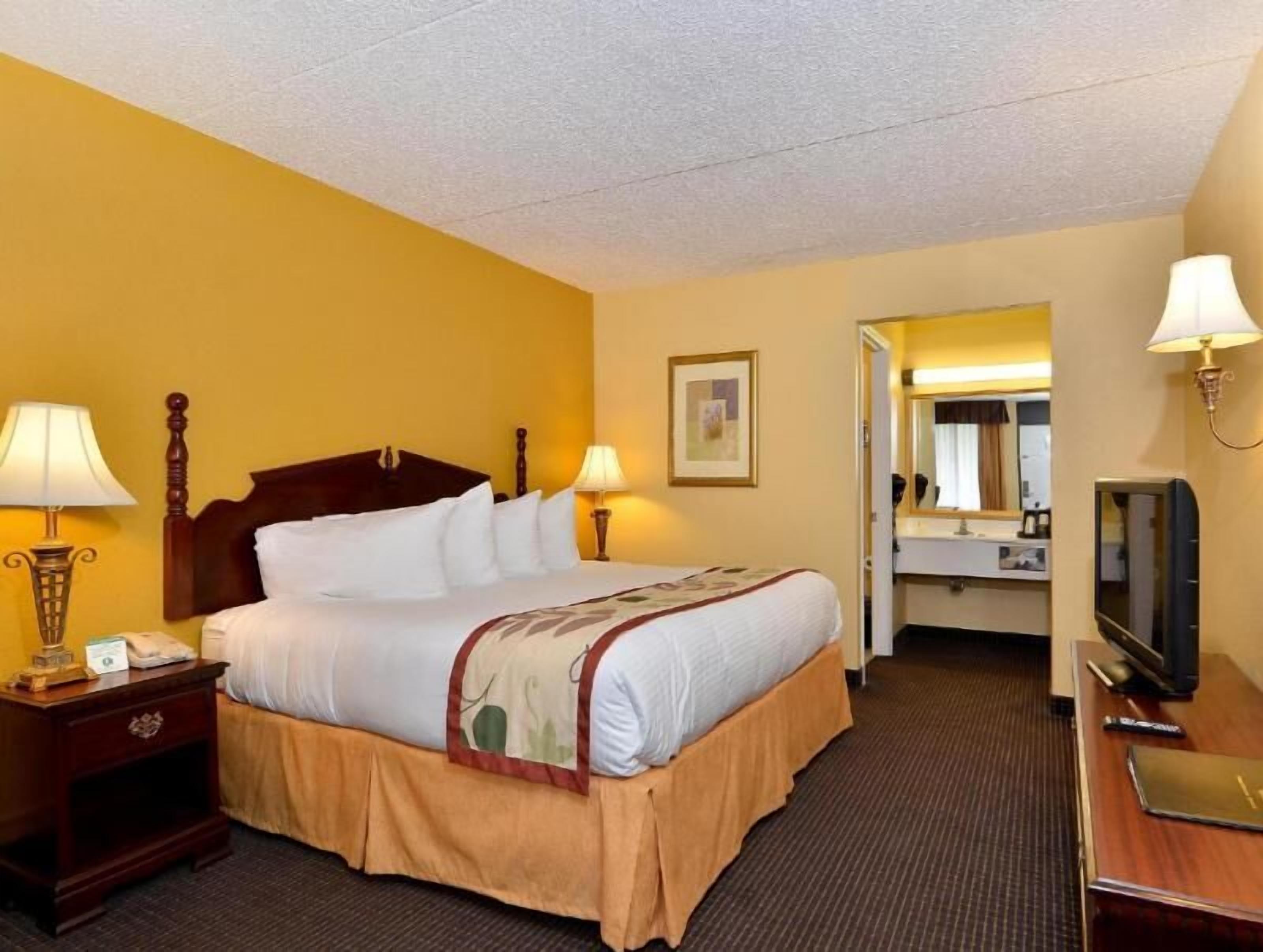 Desk, laptop workspace, blackout curtains, iron/ironing board