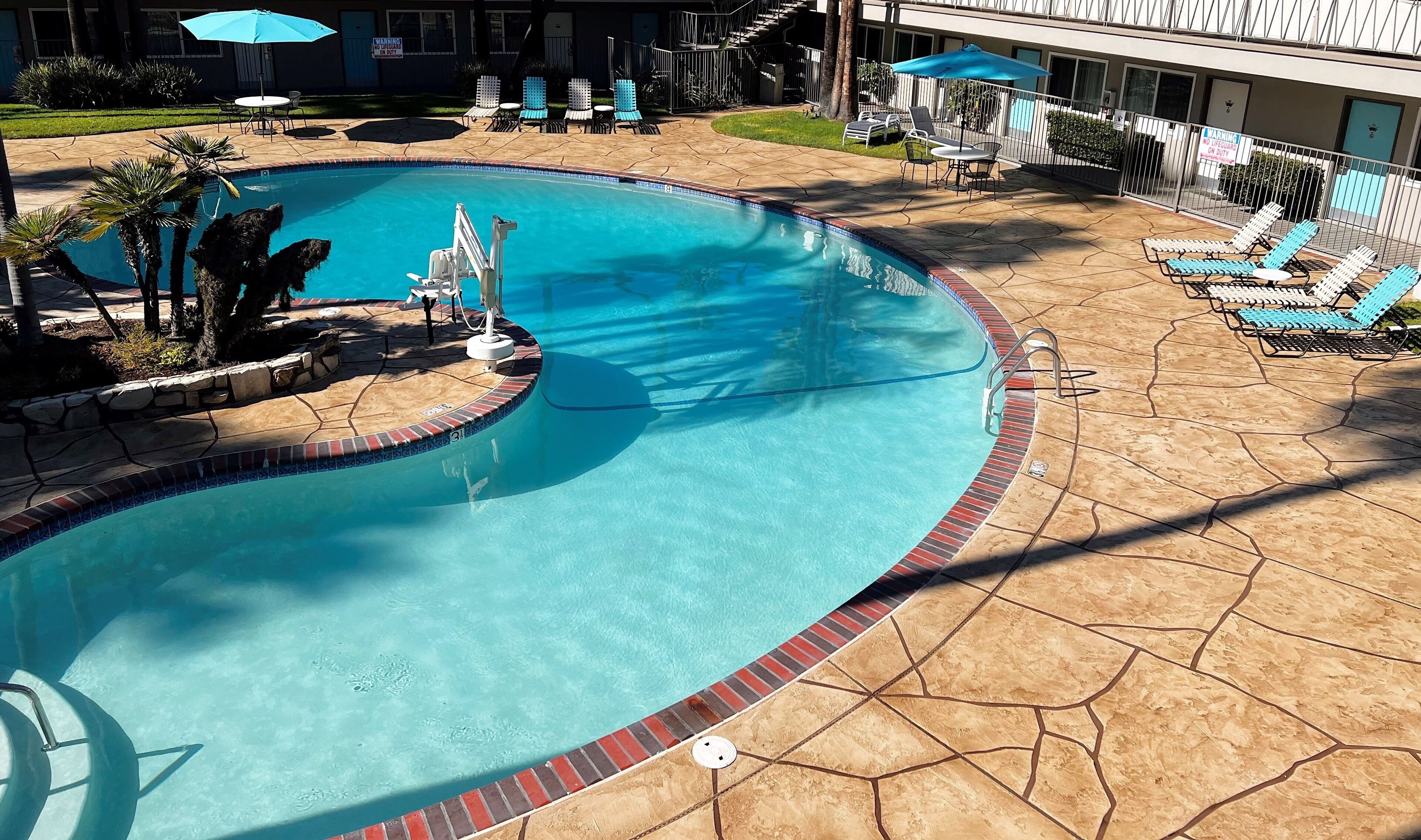 outdoor pool, open 8:00 am to 10:00 pm, pool umbrellas, pool loungers
