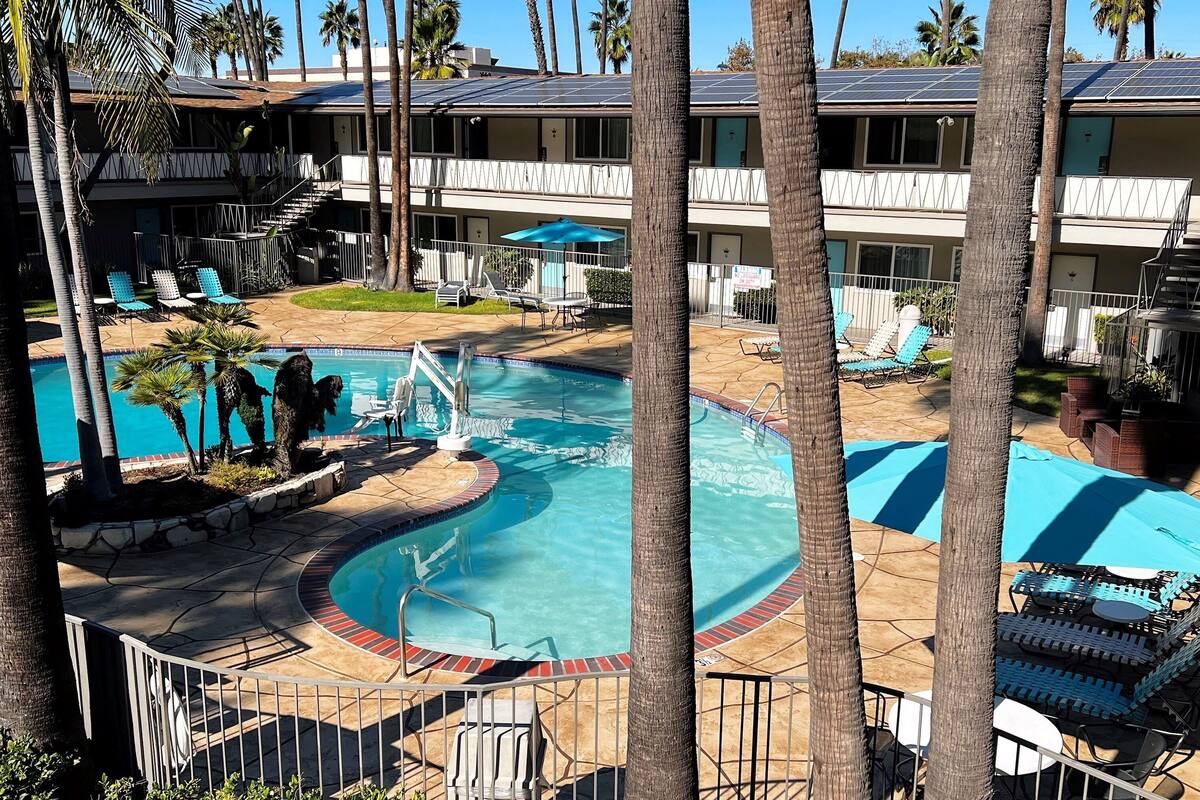 outdoor pool, open 8:00 am to 10:00 pm, pool umbrellas, pool loungers