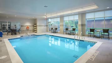 Indoor pool, open 9:00 AM to 9:00 PM, pool loungers
