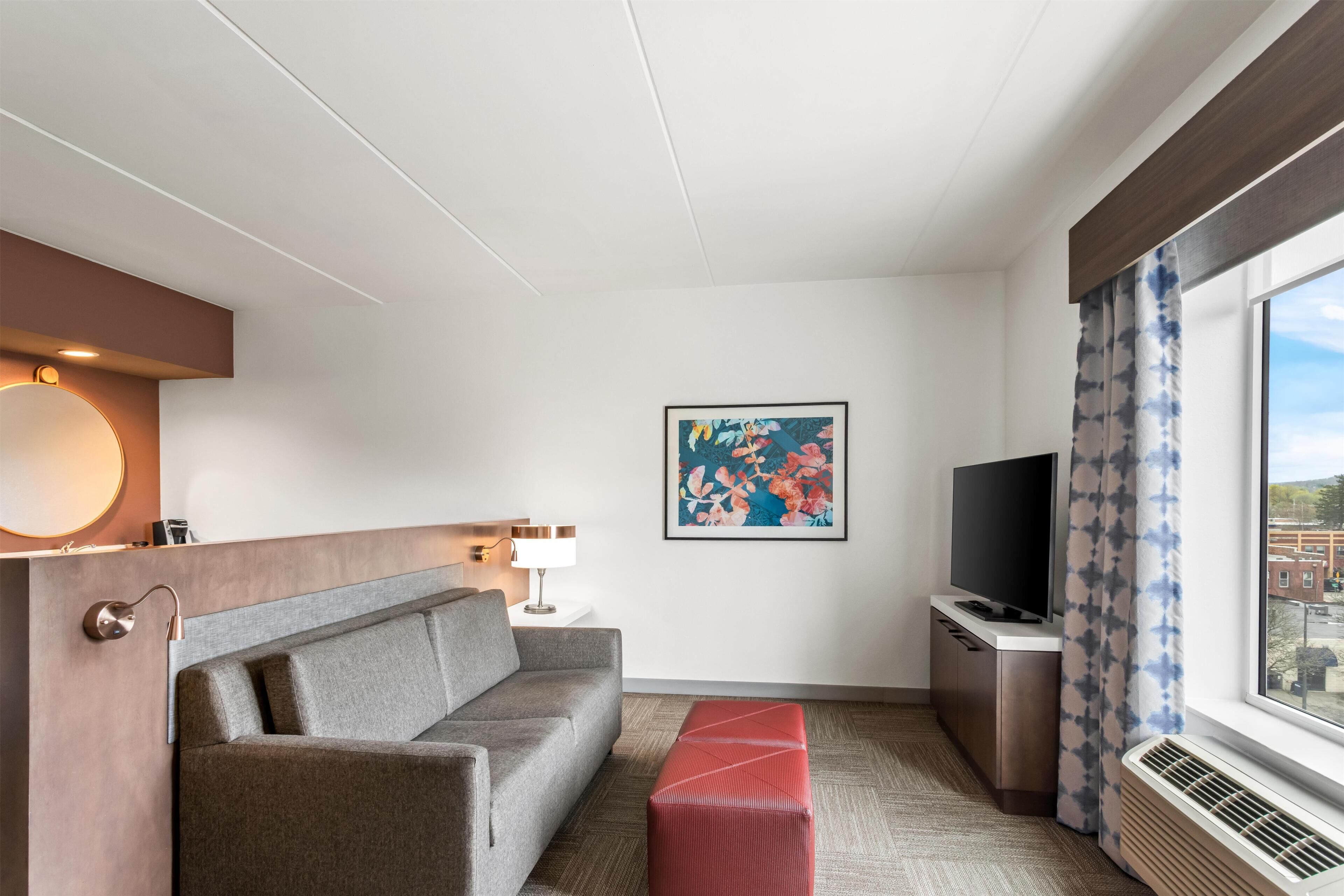 Suite, 1 Bedroom | Living area | 50-inch flat-screen TV with premium channels, TV