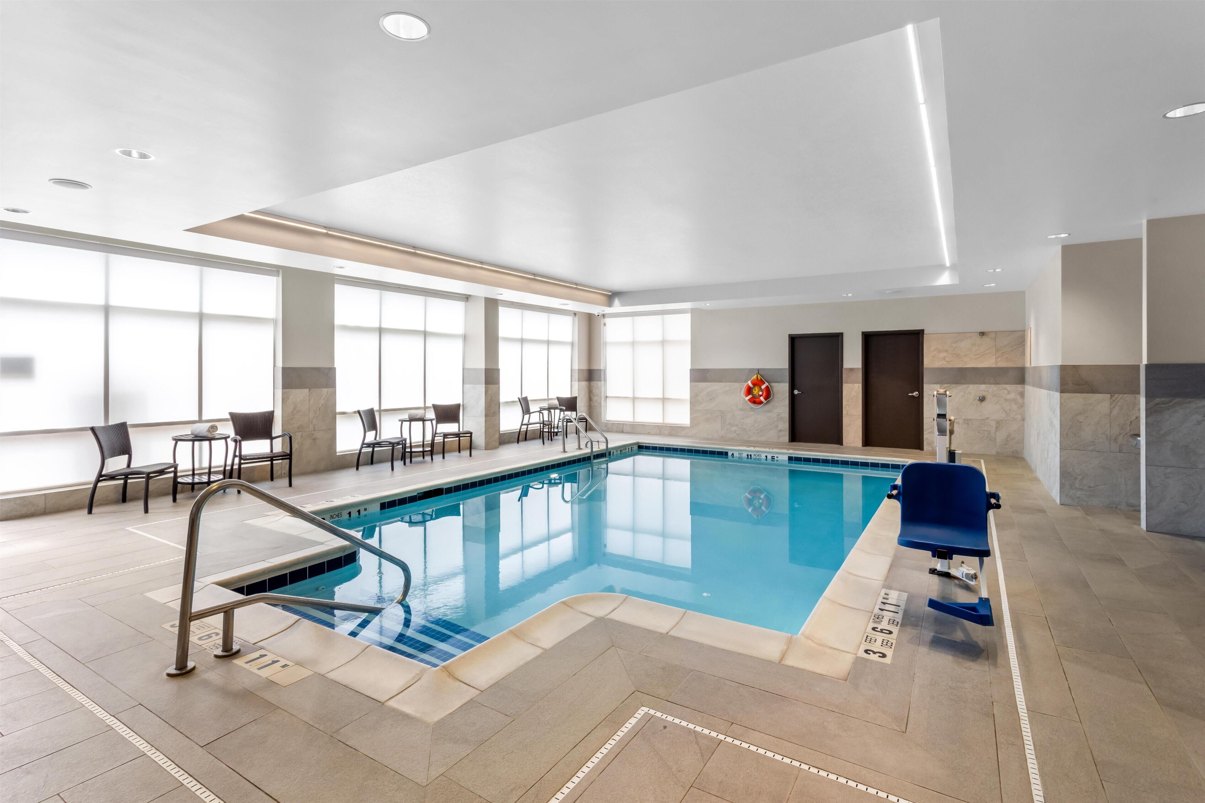 Indoor pool, open 9:00 AM to 9:00 PM, pool loungers