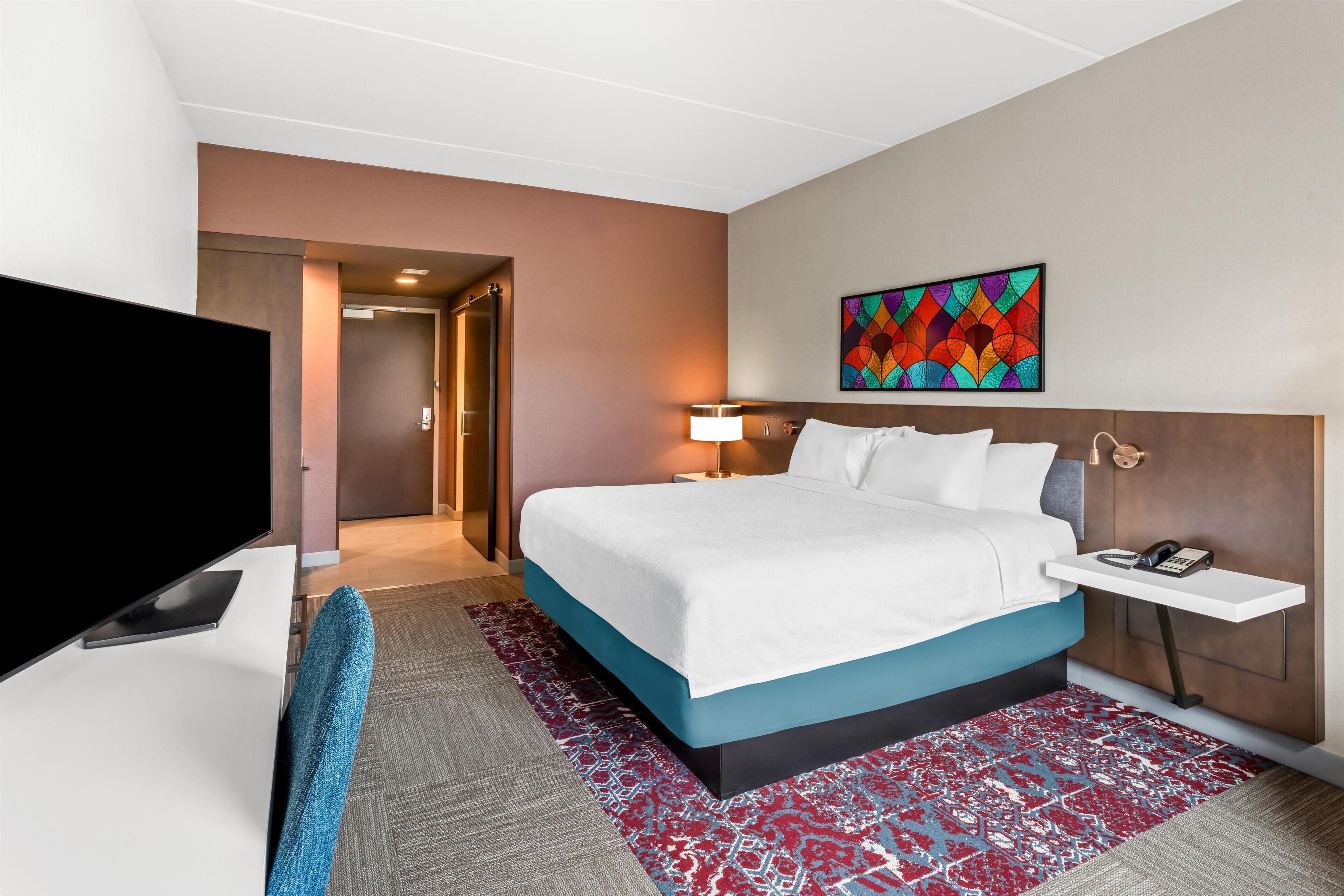 Room, 1 King Bed | Premium bedding, in-room safe, blackout drapes, iron/ironing board