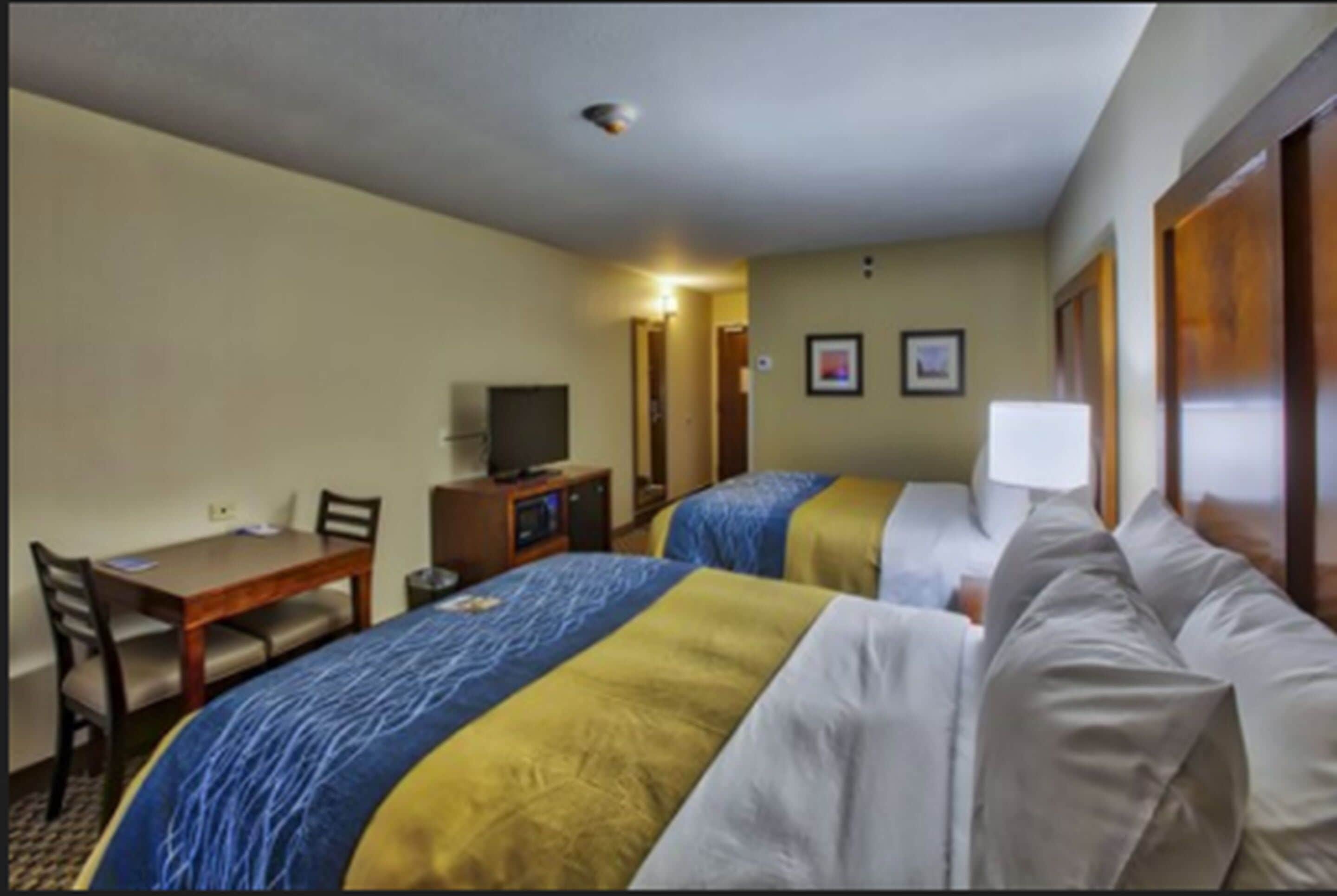 standard room, 2 queen beds, non smoking | in-room safe, laptop workspace, iron/ironing board