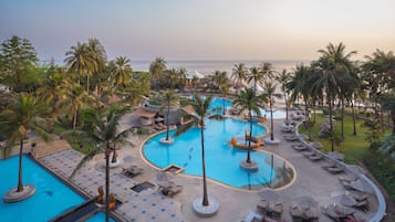 Outdoor pool, open 7:00 AM to 7:00 PM, pool umbrellas, pool loungers