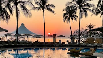 Outdoor pool, open 7:00 AM to 7:00 PM, pool umbrellas, sun loungers